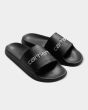 Chlancas Slider Carhartt WIP Slippers en color negro y blanco Unisex