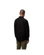 Hombre con Camisa de manga larga Carhartt WIP Madison LS Shirt Negra con el logo en blanco posterior