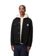 Hombre con chaqueta Carhartt WIP Michigan Coat negra