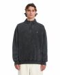 Hombre con sudadera Volcom Single Stone Quarter Zip negra lavado ácido