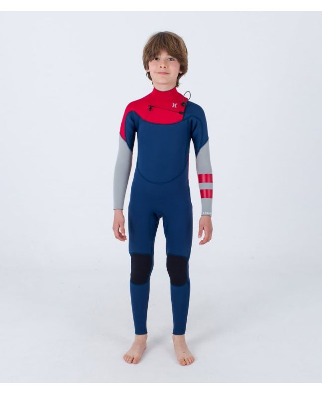 Niño con traje de neopreno con cremallera en el pecho Hurley Kid Advant 4/3mm azul marino y rojo 