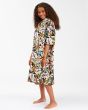 Chica con poncho de surf Billabong Teen Hooded Towel negro floral  lateral