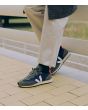 Mujer con Zapatillas Veja Rio Branco Alveomesh azul marino y verde con detalles en blanco y naranja Unisex 